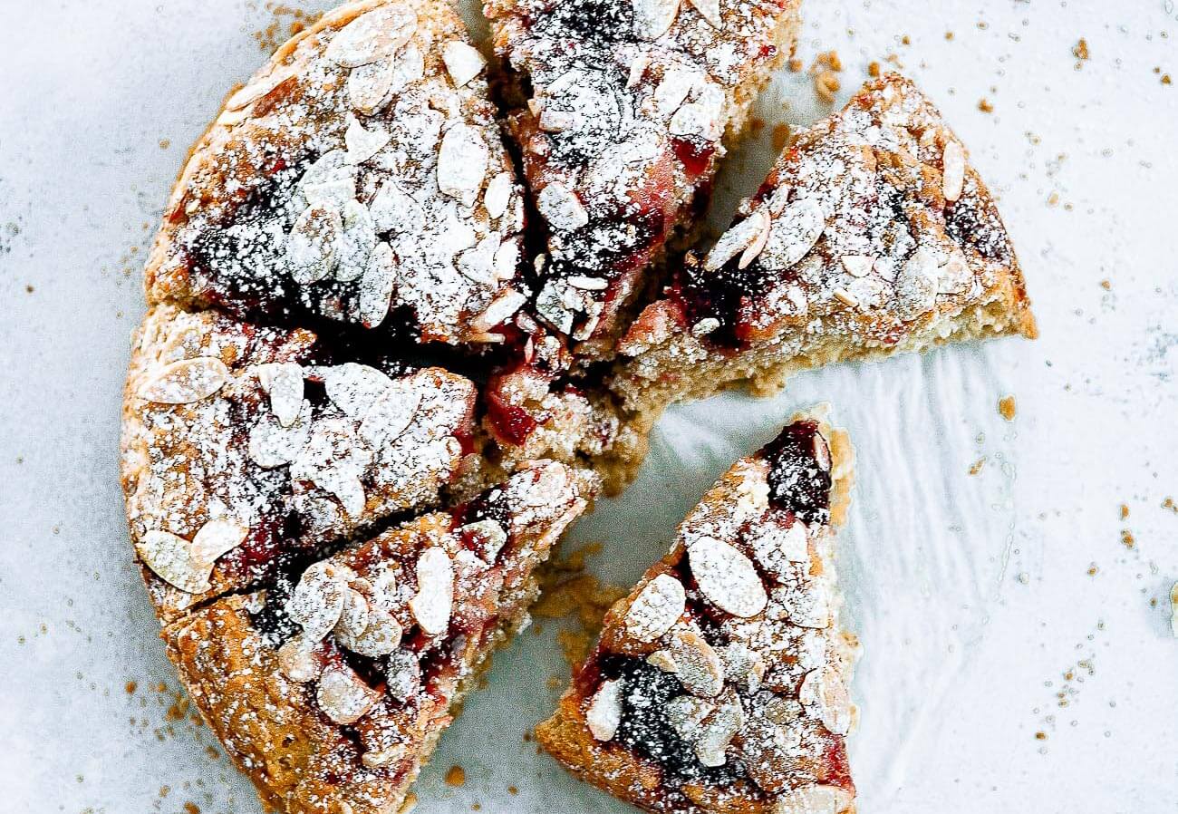 Best easy gluten free strawberry scone recipe! With swirls of strawberries, and almond slivers. Easy healthy scone recipe. Dairy free scone recipe. Coconut oil scones. Easy gluten free coffee cake recipe. Best strawberry coffee cake recipe. Easy gluten free Valentines day recipes.