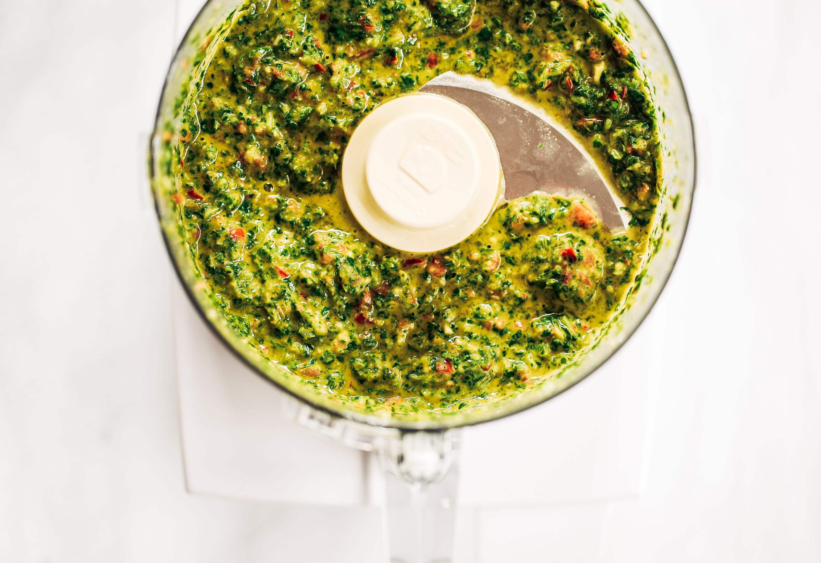 Zesty, fresh, and flavorful, cilantro garlic chimichurri with jalapeno pepper. Perfect for marinating chicken, beef, or topping off sweet potato fries and salads! Made easy in the blender in five minutes. Paleo, gluten free, and whole30 friendly. Easy whole30 dinner recipes. Whole30 recipes. Whole30 lunch. Whole30 recipes just for you. Whole30 meal planning. Whole30 meal prep. Healthy paleo meals. Healthy Whole30 recipes. Easy Whole30 recipes