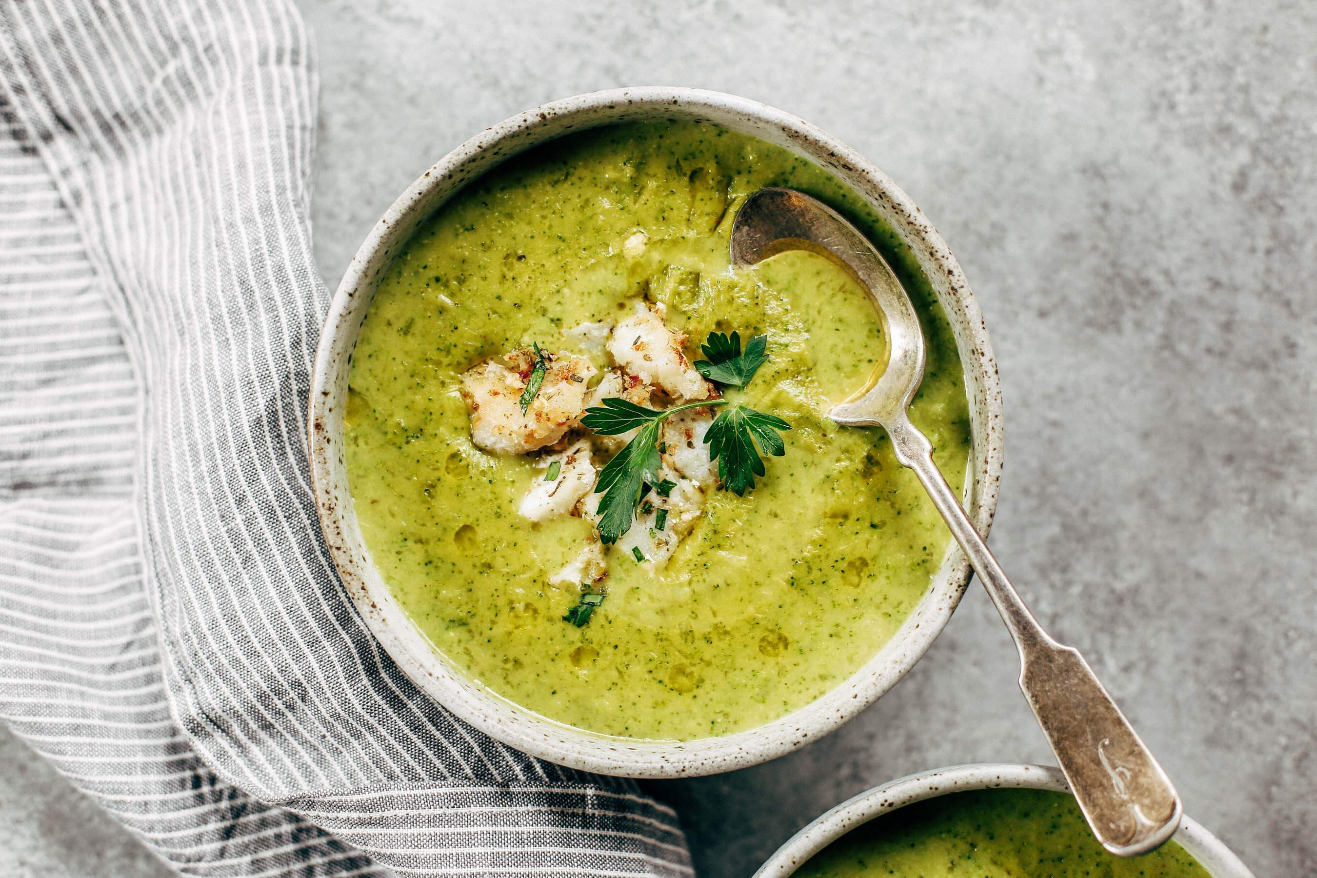 Creamy broccoli chowder with herb crusted cod. The perfect creamy and cozy soup for moody spring days. Paleo, dairy free, and whole30. Can be made ahead and frozen! Paleo soup. Whole30 soup recipe. Easy whole30 dinner recipes. Whole30 recipes. Whole30 lunch. Whole30 meal planning. Whole30 meal prep. Healthy paleo meals. Healthy Whole30 recipes. Easy Whole30 recipes. Easy whole30 dinner recipes.
