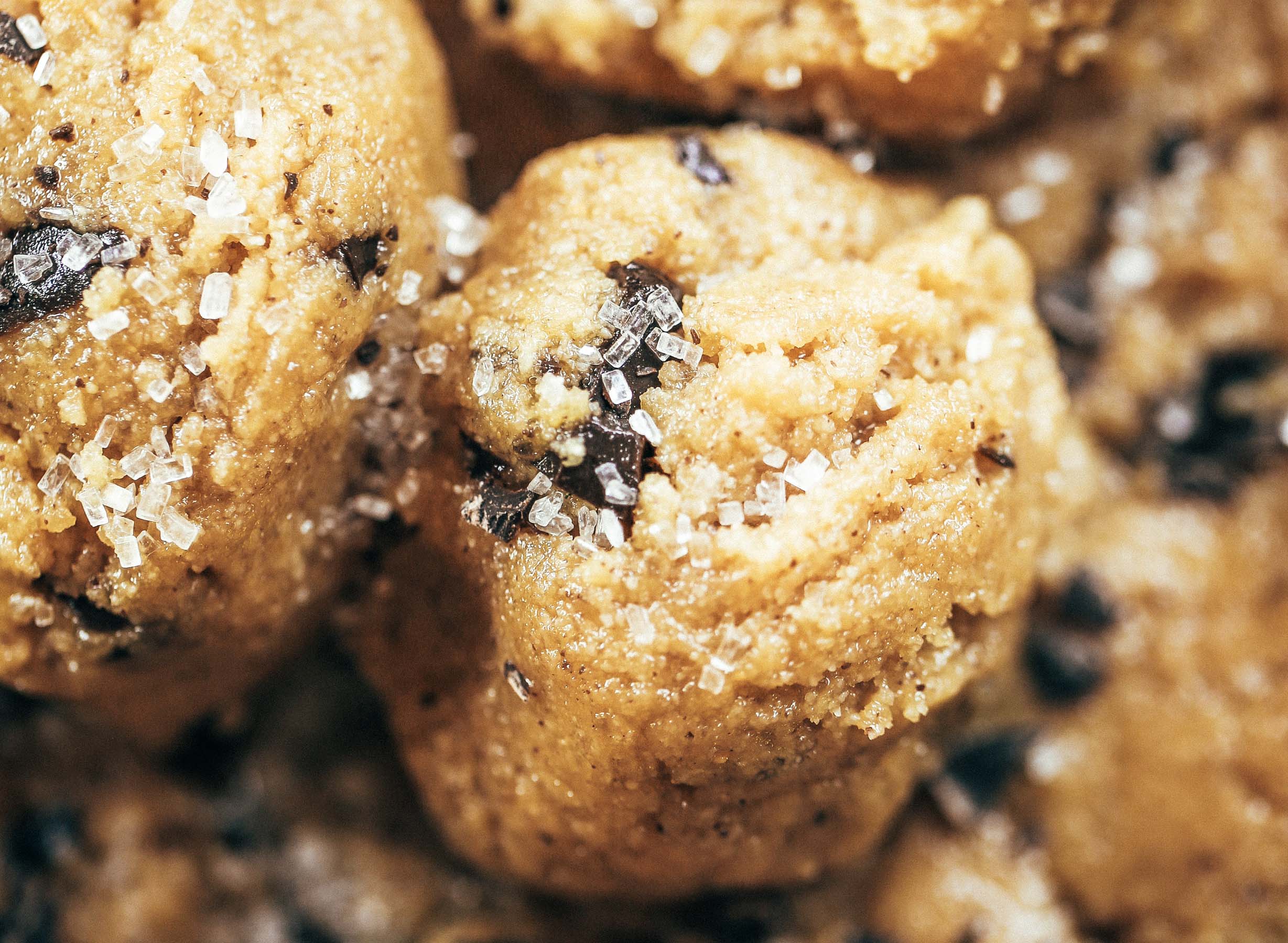 Healthy paleo cookie dough that's safe to eat raw! This cookie dough is gluten free, dairy free, and made without refined sugars. Ready in just five minutes! Paleo cookies no egg. Easy paleo cookie recipes. No bake paleo cookies. Healthy paleo cookies. Easy paleo snacks for on the go. Almond paleo cookies. best paleo cookie dough.