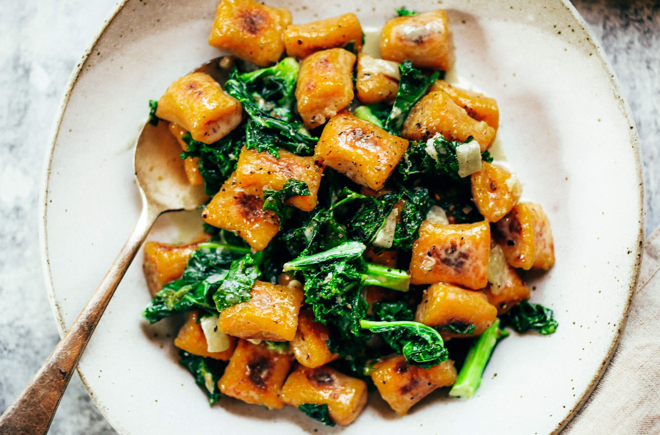 Easy paleo sweet potato gnocchi served with kale sage sauce. Delicious, healthy, family meal. Soft pillowy gnocchi made with sweet potato. Easy whole30 dinner recipes. Easy whole30 dinner recipes. Whole30 recipes. Whole30 lunch. Whole30 meal planning. Whole30 meal prep. Healthy paleo meals. Healthy Whole30 recipes. Easy Whole30 recipes. Easy whole30 dinner recipes.