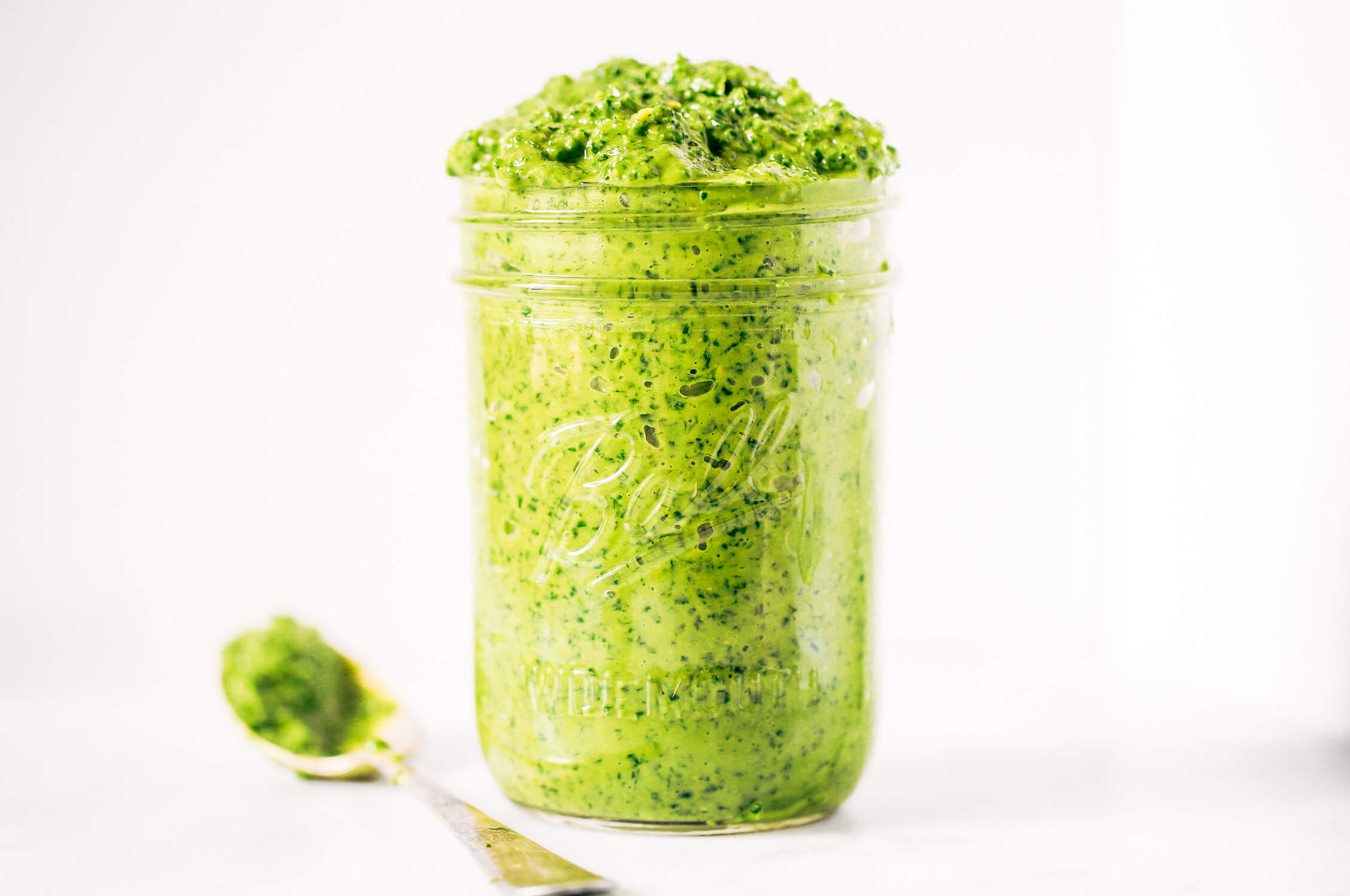 5 minute vegan kale pesto made with avocado, olive oil, and garlic. An easy paleo whole30 sauce to serve with pasta, veggie sticks, or eat with a spoon! A healthy, light, and fresh sauce. Easy whole30 pesto. paleo pesto recipe. Dairy free pesto. Best dairy free pesto recipe. Best whole30 pesto recipe.