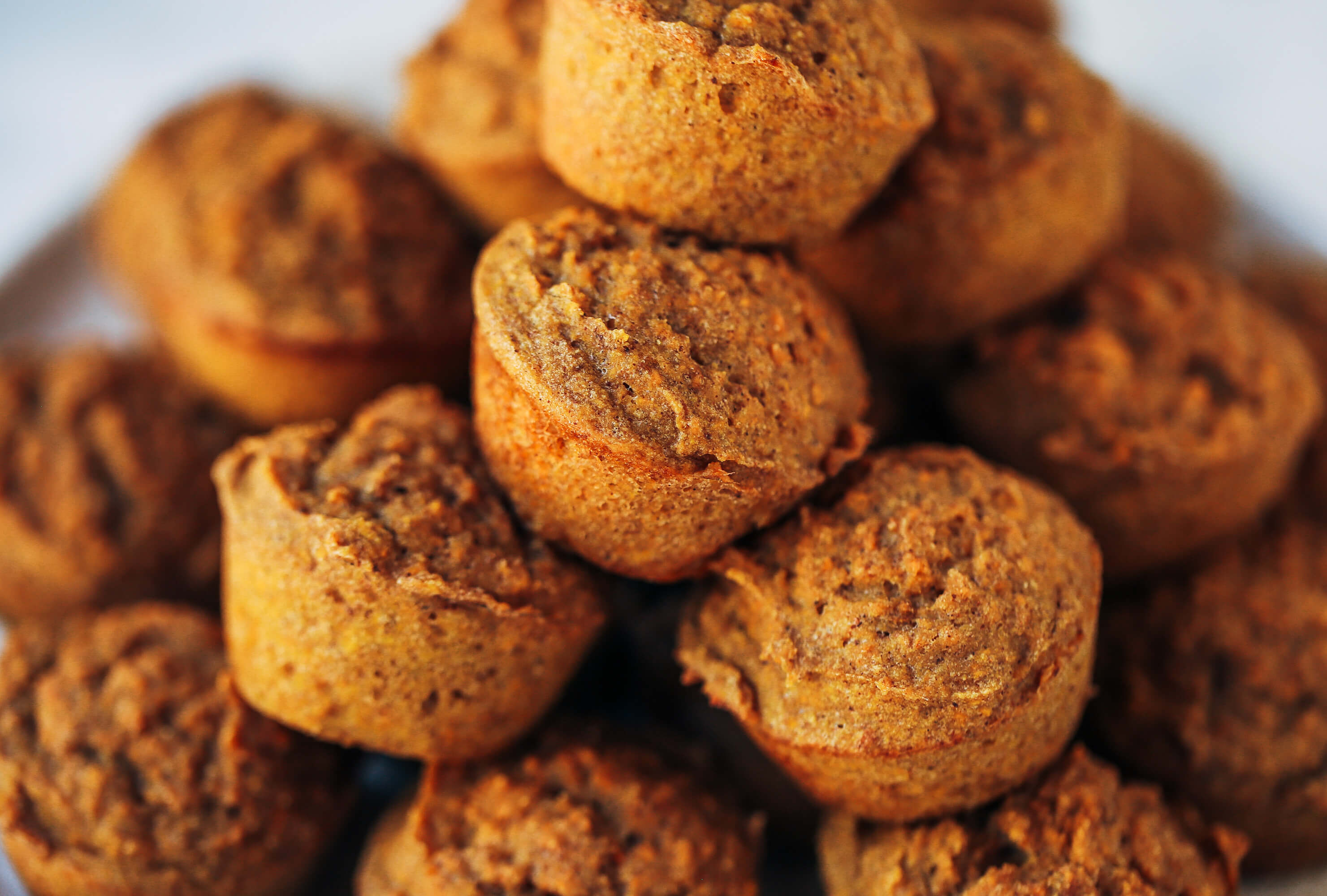 51 calorie banana muffins made with sweet potatoes instead of flour! Healthy paleo banana bread muffins make easy paleo breakfasts for on the go. Kid friendly paleo snack idea. #paleo #sugarfree #bananas #bananabread #baking #glutenfree
