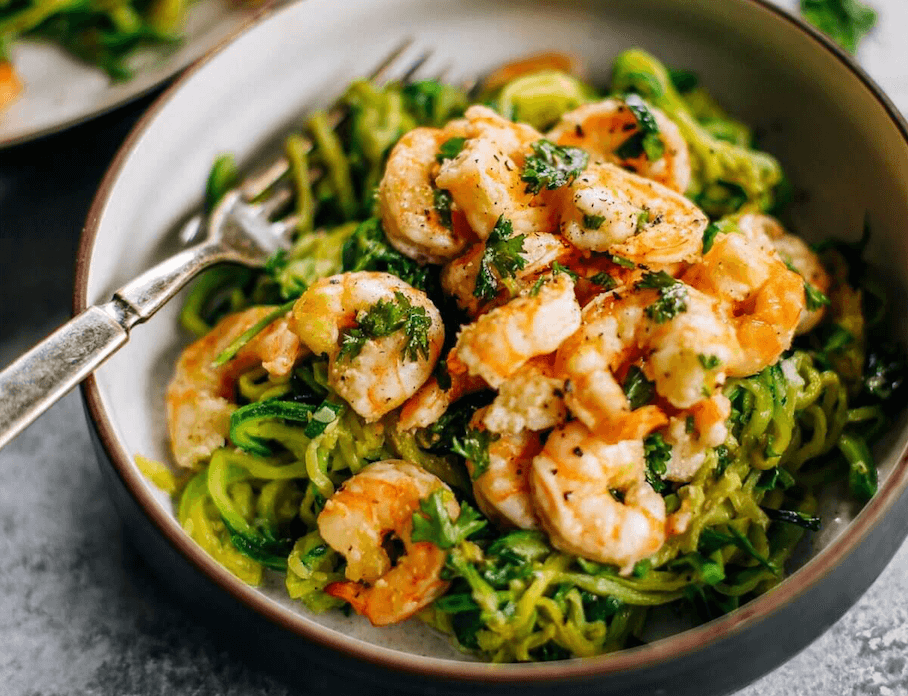 Whole30 zucchini noodles with lemon garlic shrimp. An easy and delicious weeknight dinner. Who’s ready for this healthy low calorie and filling paleo dinner? #paleo #whole30 #healthydinner
