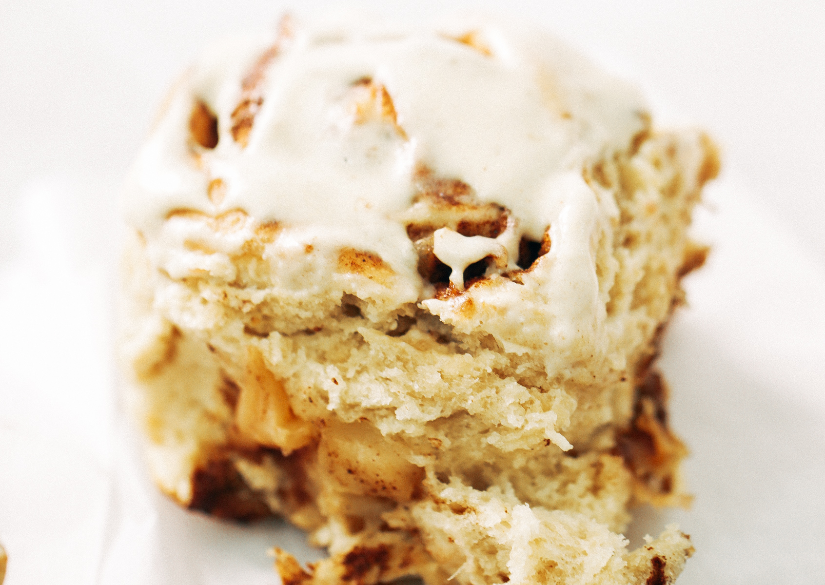 Fluffy Vegan Cinnamon Rolls made with coconut oil, almond milk, and no refined sugar! These healthier cinnamon rolls are light, fluffy, gooey, and delicious. You can make these vegan with cashew cream cheese frosting- yum!